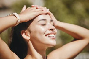 a woman with her hands on her forehead