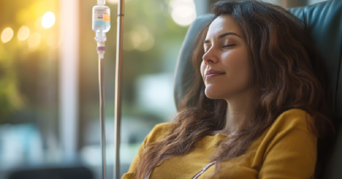 Woman relaxing in a medical chair during Nutritional IV Therapy in Valencia, CA