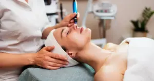 Plasma Pen treatment on a woman's face at a spa in Valencia, CA