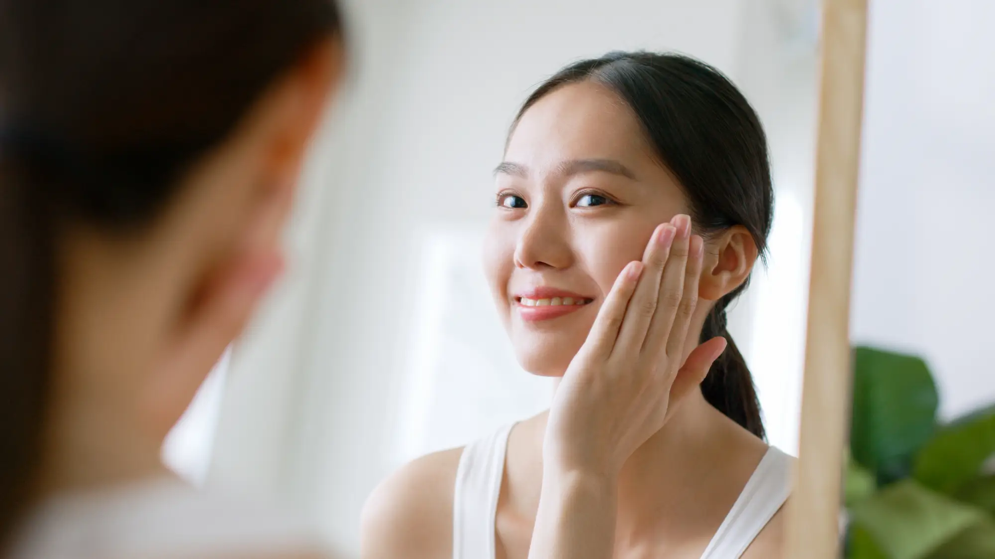 a woman touching her face