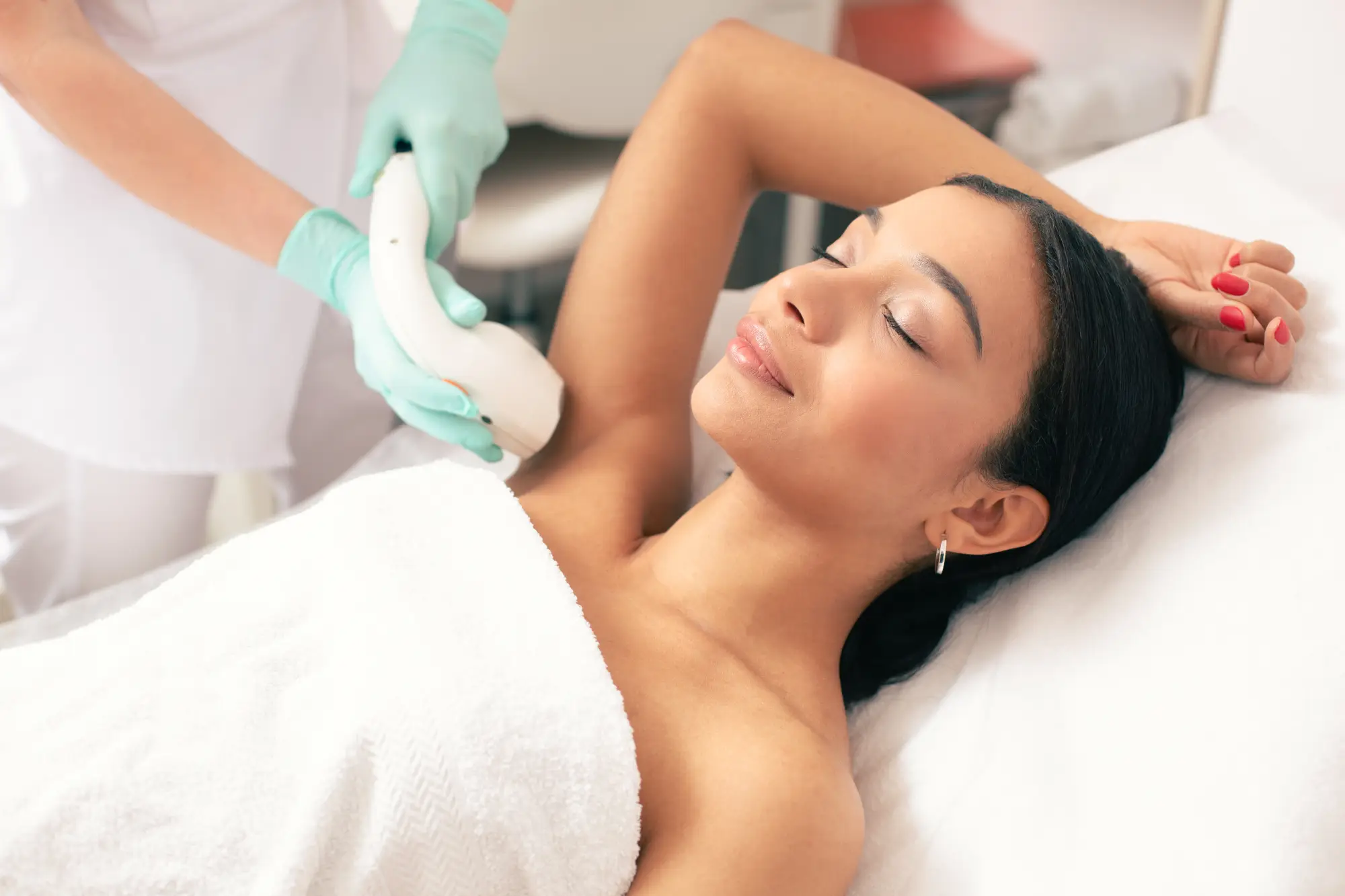 a woman lying down on a massage table