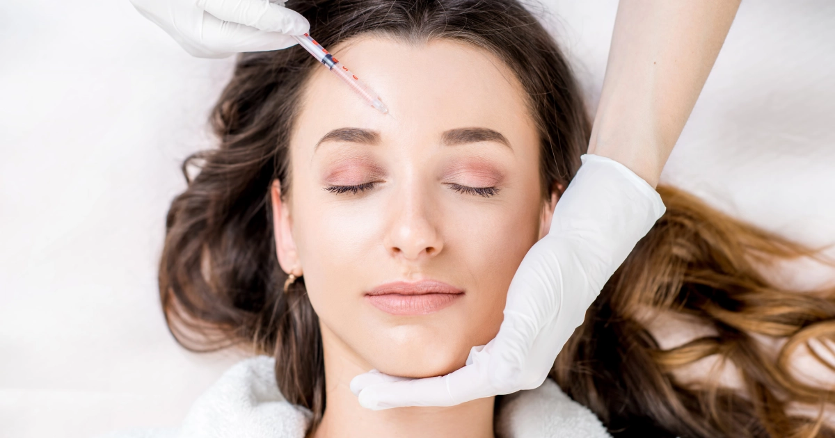 A woman receives a neuromodulators injection in her forehead in Valencia, CA